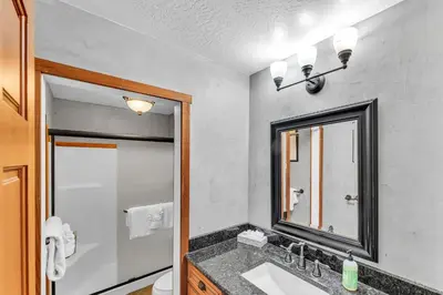 a bathroom with a sink and a mirror at Northstar Retreat with Hot Tub & FREE Shuttle Access in Truckee