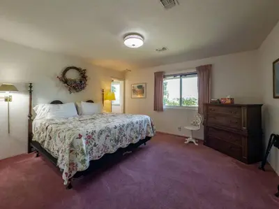 a bedroom with a bed and a dresser and a window at Yosemite Mountain Top Retreat Hilltop Manor Pool Spa in Mariposa