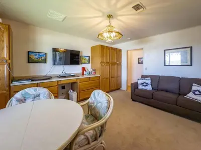 a living room with a table and a couch at Yosemite Mountain Top Retreat Hilltop Manor Pool Spa in Mariposa
