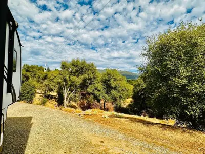 a view of a dirt road from a bus at Puffy Panda RV-Hot Tub-Sleeps 2 in Ahwahnee