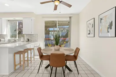 a kitchen and dining room with a table and chairs at Remodeled 3B2B Bright House with a King Suite in Sacramento
