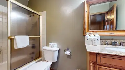 a bathroom with a toilet and a shower and a sink at Winterset #33 condo in Mammoth Lakes