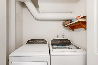 a laundry room with a washer and dryer at Green Abode in Groveland