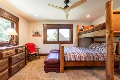 a bedroom with a bunk bed and a desk at Serenity at Dollar Point - Luxurious 4BR w Private Backyard in Tahoe City