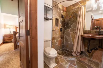 a bathroom with a toilet and a sink at Serenity at Dollar Point - Luxurious 4BR w Private Backyard in Tahoe City