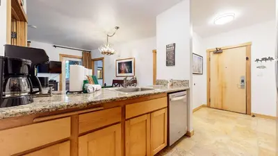 a kitchen with a sink and a counter top at Juniper Springs Lodge #246 condo in Mammoth Lakes