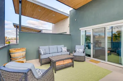 a patio with a couch and chairs and a table at Less Than 2 Mi to Dtwn Reno Luxe MidTown Gem with Patio in Reno