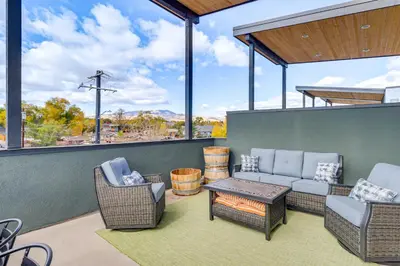 a patio with chairs and a couch and a table at Less Than 2 Mi to Dtwn Reno Luxe MidTown Gem with Patio in Reno