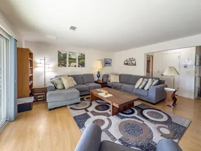 a living room with a couch and a table at Yosemite Mountaintop Retreat on 100 acres, 2 Homes, 2 hot tubs, pool in Mariposa