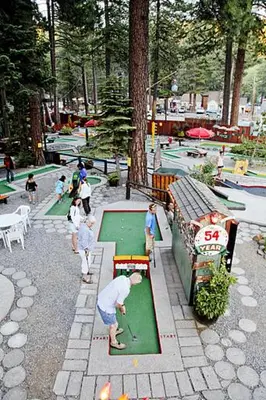 a group of people playing golf in a park at Happy Cabin Near Snow and Lake with Hot Tub, Dogs OK in Tahoe Vista