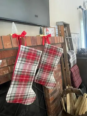 three christmas stockings hanging on a brick wall at Sunset Retreat AC, Big Views & Dream Deck in Shaver Lake