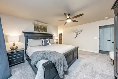 a bedroom with a bed and a ceiling fan at Sunset Retreat AC, Big Views & Dream Deck in Shaver Lake