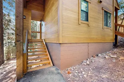 a house with a staircase on the side of it at Gold Bend Getaway in Truckee
