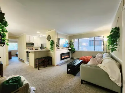 a living room with a couch and a kitchen at Tahoe Shoreline Retreat - Close to Ski Resorts & HOA Amenities in Tahoe Vista