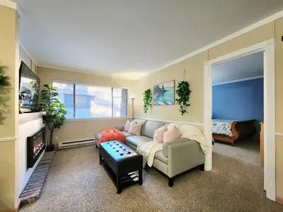 a living room with a couch and a tv at Tahoe Shoreline Retreat - Close to Ski Resorts & HOA Amenities in Tahoe Vista
