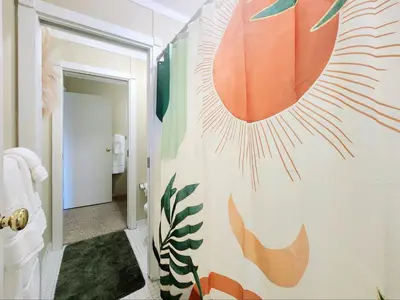 a bathroom with a shower with a mural on the wall at Tahoe Shoreline Retreat - Close to Ski Resorts & HOA Amenities in Tahoe Vista