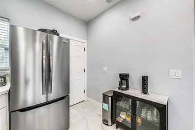 a kitchen with a stainless steel refrigerator at Small-Town Charm and Patio Dining Home in Madera! in Madera