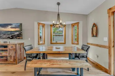 a dining room with a wooden table and chairs at Tahoe Retreat with Scenic Views and Spacious Deck in Tahoe Vista