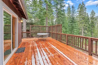 a wooden deck with a table on it at Tahoe Retreat with Scenic Views and Spacious Deck in Tahoe Vista