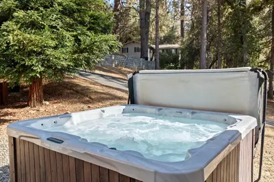 a jacuzzi tub sitting in a yard at Zen Whisper in the Woods in Groveland