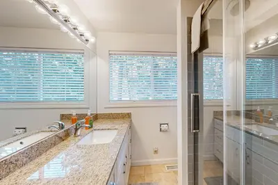 a bathroom with a sink and a shower at Lipan Lodge in South Lake Tahoe