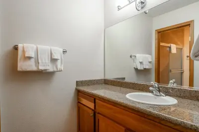 a bathroom with a sink and a mirror at Summit #269 - 2 Bedrm 2 Bathrm Condo - Walk To Eagle Lodge Lifts in Mammoth Lakes