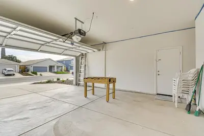 a patio with a table and chairs in a garage at Chowchilla Home with Private Patio! in Chowchilla