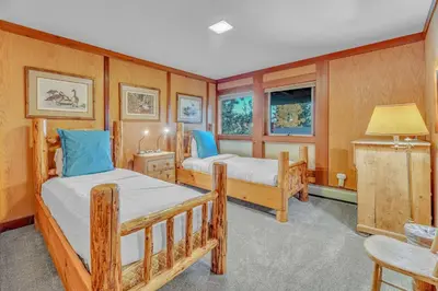 a bedroom with two bunk beds and a table at 3-Level Getaway Minutes from Lake Tahoe in Tahoe City