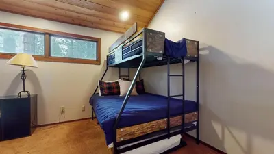 a bedroom with two bunk beds in a room at Woodlands #40 condo in Mammoth Lakes
