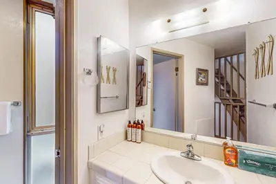 a bathroom with a sink and a mirror at Sierra Park Villas 56 L in Mammoth Lakes