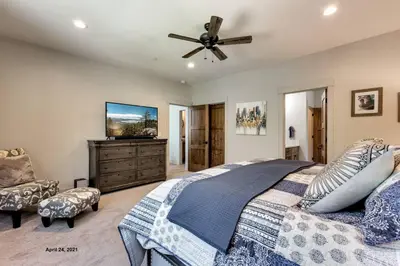 a bedroom with a bed and a ceiling fan at Grandview Manor - Luxury - Hot tub - Stylish in South Lake Tahoe