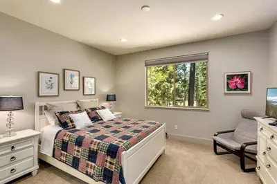 a bedroom with a bed and a window at Grandview Manor - Luxury - Hot tub - Stylish in South Lake Tahoe