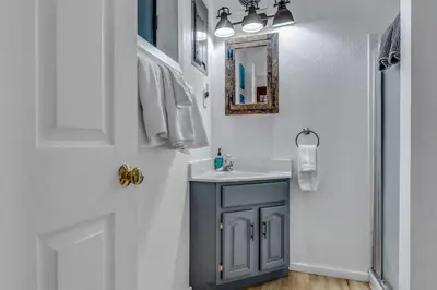 a bathroom with a sink and a mirror at White Fir Chalet Dog Friendly Cabin in the Woods in Soda Springs