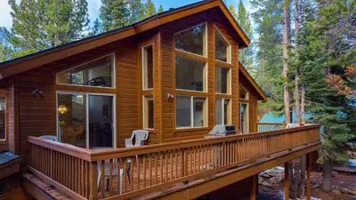a cabin in the woods with a large deck at Hansel by AvantStay Pool Table 5mins to Skiing in Truckee