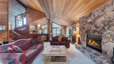 a living room with a couch and a fireplace at Northstar Hideaway by AvantStay 5mins to Skiing in Truckee