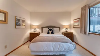 a bedroom with a large bed with two night stands at Northstar Hideaway by AvantStay 5mins to Skiing in Truckee