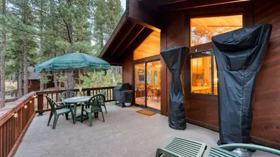 a porch of a house with a table and chairs at Northstar Hideaway by AvantStay 5mins to Skiing in Truckee