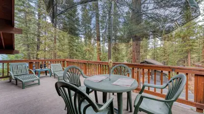 a deck with chairs and a table and chairs at Northstar Hideaway by AvantStay 5mins to Skiing in Truckee