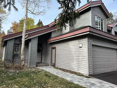 a house with a garage at Snowcreek IV #545 condo in Mammoth Lakes