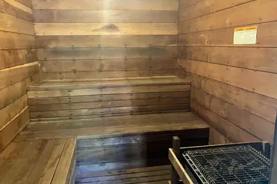 a wooden sauna with a bench in the corner at La Residence M9 in Mammoth Lakes