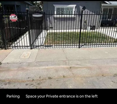 a black wrought iron fence in front of a house at Charming Casita all too yourself near Midtown, Train and Freeway in Sacramento