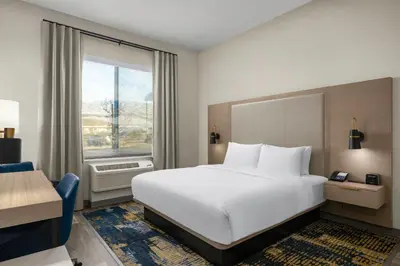 a hotel room with a bed and a window at Fairfield Inn & Suites Livermore in Livermore