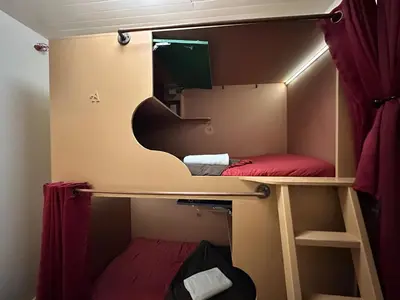 a small room with a bunk bed in it at West River House in Truckee