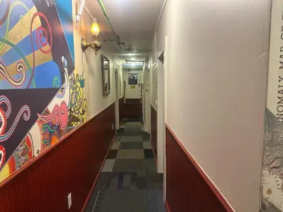 a hallway with colorful walls and a long hallway at West River House in Truckee