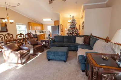 a living room with a couch and a christmas tree at Eagle Retreat Mountain Escape New With AC in Shaver Lake