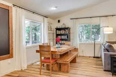 a dining room with a wooden table and chairs at Forest-View Retreat Grill and Fireplace in Sonora in Sonora