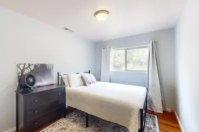 a bedroom with a bed and a window at Uhre Family Retreat in Oakhurst