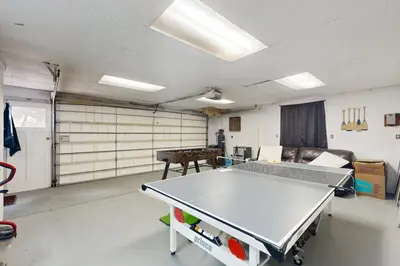 a room with a ping pong table in it at Uhre Family Retreat in Oakhurst