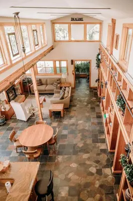 a large living room with a table and chairs at Oak Meadows House - A unique home near Yosemite in Mariposa