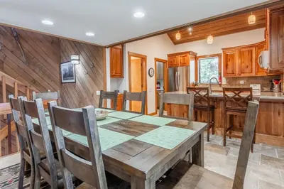 a kitchen and dining room with a wooden table and chairs at Snowcreek #482 - Updated ! 3 Bedroom + Loft, 2 Bathroom, Sleeps 10! in Mammoth Lakes